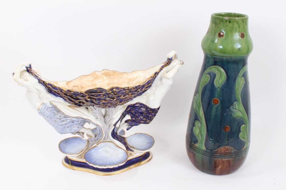 Lot 103 - Large Belgian Art Nouveau pottery vase, 44cm high, together with a continental centrepiece, in the form of two nude female figures holding a seaweed bowl, with four smaller shell-shaped bowls aroun...