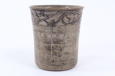 Lot 16 - An unusual antique earthenware beaker, inscribed 'PIERRE DE LA MER - MORTE', with incised foliate patterns, 8cm high