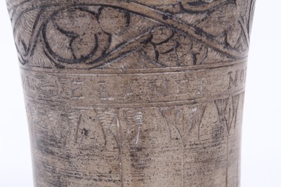 Lot 137 - An unusual antique earthenware beaker, inscribed 'PIERRE DE LA MER - MORTE', with incised foliate patterns, 8cm high