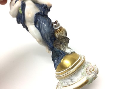 Lot 138 - A Meissen porcelain figure, emblematic of night, modelled as putti wearing a dark cloak with star head band and owl seated beside, cross swords mark to base and incised M 106, 18cm high