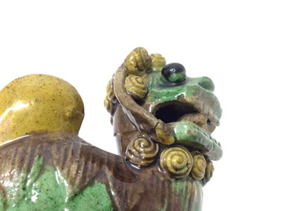 Lot 119 - A pair of Chinese blanc de chine foo dog incense burners