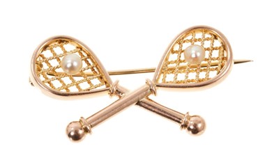 Lot 505 - Late Victorian gold tennis racket brooch, each racket set with a seed pearl