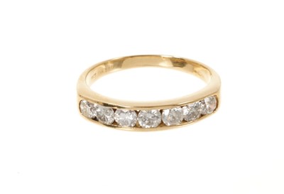 Lot 507 - 18ct yellow gold brilliant cut diamond channel set half eternity ring marked 18ct. 1 carat total weight finger size P 4gms