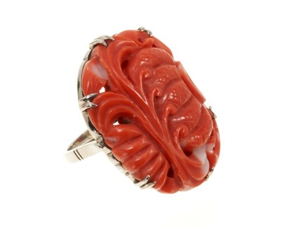 Lot 508 - Vintage 1930s 14ct white gold ring set with an oval carved coral of oriental design J½ finger size 30mm x 22mm