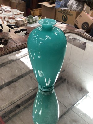 Lot 101 - Antique turquoise glass vase with trailed foot, (turquoise glass cased over opaque glass)