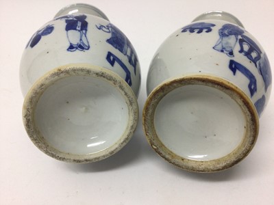 Lot 162 - A pair of 19th century Chinese blue and white porcelain vases, of baluster form, each painted with a figural scene, with foliate patterns around the neck and foot, 23cm high