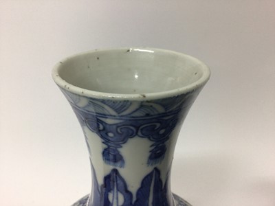 Lot 129 - Two similar 19th century Chinese blue and white bottle vases, both decorated with dragons, foliate patterns, ruyi symbols, etc, marks to bases, 22cm and 24.5cm high
