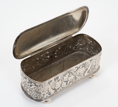 Lot 316 - Late 19th century Chinese silver hairpin box with hinged cover of oval form with prunus decoration on ball feet, Chinese mark and 'Luen Wo' mark. 11.5 cm