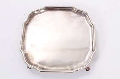 Lot 299 - George VI silver card tray or waiter of square form with pie crust border, raised on three hoof feet, (Sheffield 1937), maker James Dixon & Sons, all at 6ozs, 13cm in diameter.