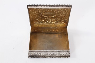 Lot 319 - Victorian silver dressing table box with repoussé floral scroll decoration (London 1884) 11.5 x 8.5 x 4 cm , Victorian silver smelling salts bottle and silver topped cut glass toilet jar (3)