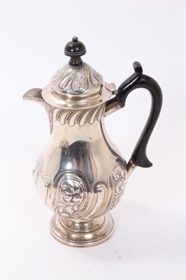 Lot 322 - Late Victorian silver hot water pot with floral scrollwork decoration (London 1896) 23cm high
