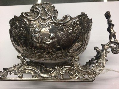 Lot 323 - Late 19th/early 20th century Hanau silver by Karl Kurz, Kesselstadt silver sledge table ornament with repoussé figure decoration 14.5cm and silver pot