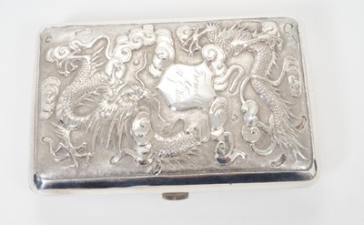 Lot 331 - Late 19th/early 20th century Chinese white metal cigarette case of rectangular form, with raised Dragon and chrysanthemum decoration, engraved presentation inscription and silver gilt interior, app...