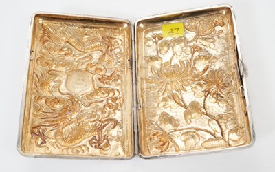 Lot 331 - Late 19th/early 20th century Chinese white metal cigarette case of rectangular form, with raised Dragon and chrysanthemum decoration, engraved presentation inscription and silver gilt interior, app...