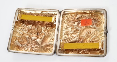Lot 332 - Late 19th/early 20th century Chinese silver cigarette case with raised Dragon decoration and silver gilt interior with Chinese character mark. All at approximately 3ozs. 8.5cm overall length.