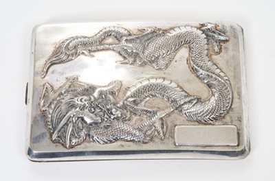 Lot 333 - Late 19th/early 20th century Chinese silver cigarette case of shaped rectangular form, with raised Dragon decoration and vacant to front and plain rear, silver gilt interior with Chinese character...