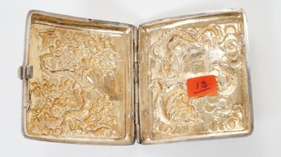 Lot 335 - Late 19th/early 20th century Chinese white metal cigarette case, the cover with raised Dragon decoration and a vacant cartouche, the rear with birds in cherry tree, silver gilt interior, marked onl...