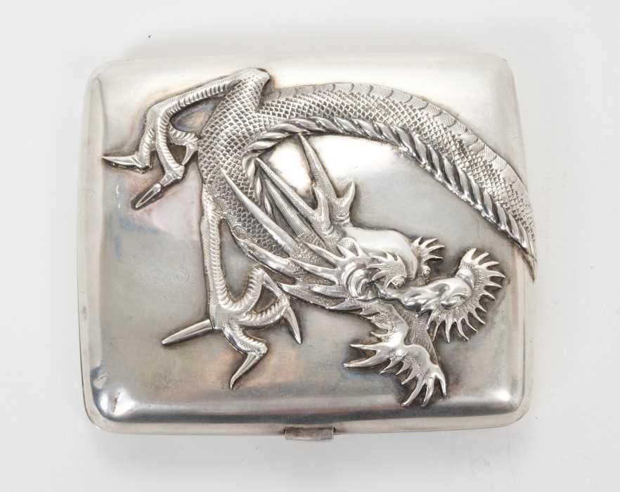 Lot 337 - Late 19th/early 20th century Chinese white metal cigarette case with raised continuous Dragon decoration and silver gilt interior, apprently unmarked. All at approximately 4ozs. 8.3cm overall lengt...