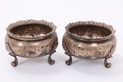 Lot 312 - Pair of Victorian silver salt cellars of cauldron form with gadrooned borders, raised on three scroll feet (London 1845 / 1848), maker George Ivory, together with a pair of 18th century white metal...