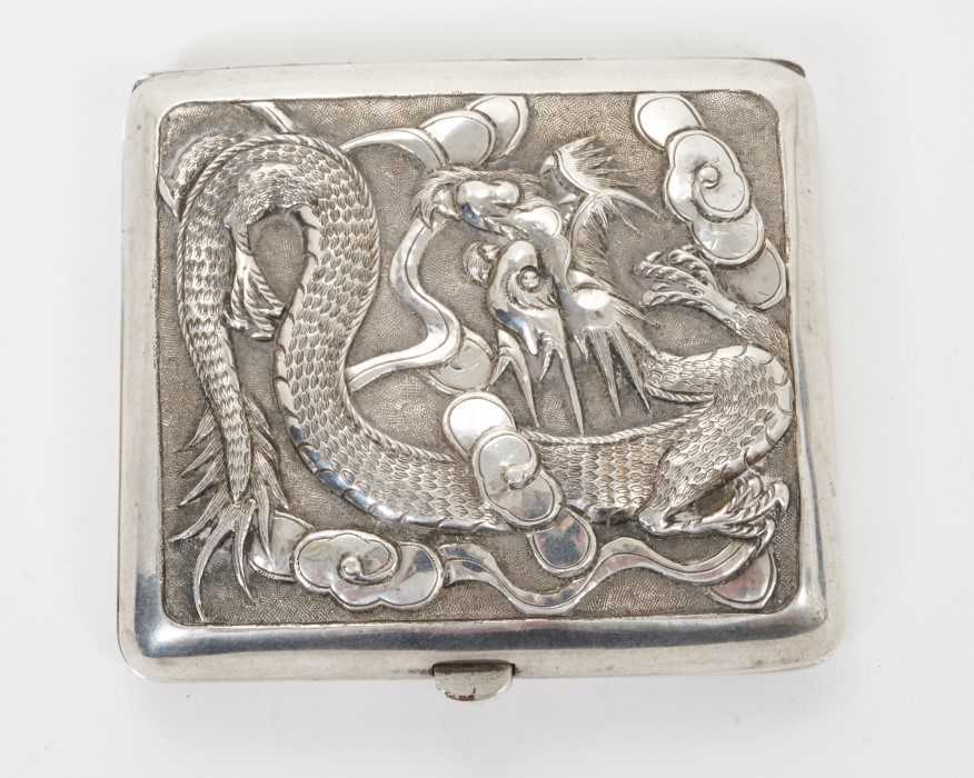 Lot 338 - Late 19th/early 20th century Chinese white cigarette case with raised Dragon decoration and engraved presentation inscription, silver gilt interior, apparently unmarked.  All at approximately 2ozs....