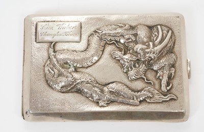 Lot 339 - Late 19th/early 20th century Chinese white metal cigarette case with raised Dragon decoration and engraved cartouche, silver interior with Chinese character, apparently unmarked.  All at approximat...