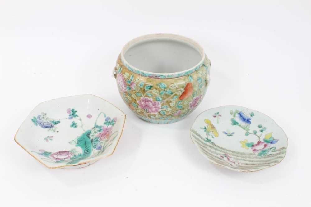 Lot 150 - A 19th century Chinese Straits-style famille rose porcelain bowl, painted with flowers, with lugs for handles, together with two 19th cenutry Chinese famille rose dishes (3)