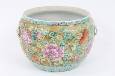 Lot 150 - A 19th century Chinese Straits-style famille rose porcelain bowl, painted with flowers, with lugs for handles, together with two 19th cenutry Chinese famille rose dishes (3)
