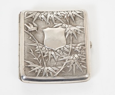 Lot 343 - Late 19th/early 20th century Chinese white metal cigarette case, the cover with raised floral decoration, the rear with bamboo decoration and vacant cartouche, silver gilt interior, apparently unma...