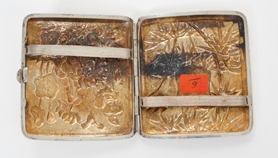 Lot 343 - Late 19th/early 20th century Chinese white metal cigarette case, the cover with raised floral decoration, the rear with bamboo decoration and vacant cartouche, silver gilt interior, apparently unma...