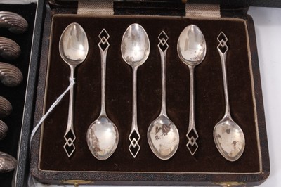 Lot 354 - Set of six George V silver coffee spoons, (Birmingham 1933), maker William Adams Ltd, in a fitted case, together with another set of six silver teaspoons and matching sugar tongs in a fitted case a...