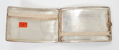 Lot 345 - Late 19th/early 20th century Chinese white metal cigarette case the cover with raised Dragon and fish decoration and gold metal initials, the rear with engraved fortress scene, silver gilt interior...
