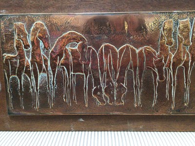 Lot 694 - Nang Seng Lim (1916-1987), beaten copper panel decorated with horses entitled on reverse ' Team of horses', mounted on panel 39 x109cm