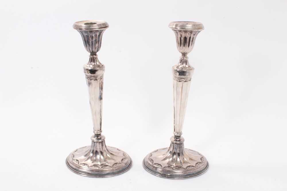Lot 361 - Pair of Edwardian Georgian-style silver plated candlesticks of oval form