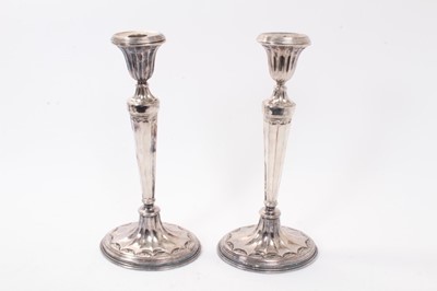 Lot 361 - Pair of Edwardian Georgian-style silver plated candlesticks of oval form