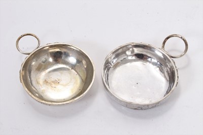 Lot 362 - Pair of 19th century French silver wine tasters, one stamped J Supiot, the other R Bidet, each 7.3cm in diameter.