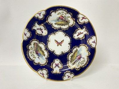 Lot 194 - Fine Flight, Barr and Barr Worcester plate, painted with birds and insects, on a blue scale ground, circa 1813-1815, red printed mark, 24 cm diameter