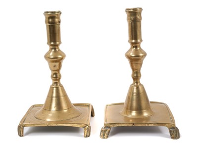 Lot 1369 - Rare pair of early 18th century Spanish brass candlesticks, on footed square bases, 21.5cm high