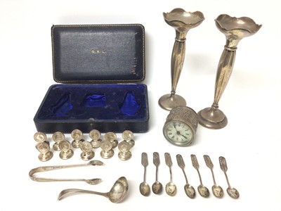 Lot 379 - George V silver spill vase, (Birmingham 1925), together with another similar, eleven silver menu holders, stamped Sterling, an Eastern white metal clock and other items (various dates and makers),...