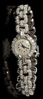 Lot 583 - Fine ladies' diamond bracelet Watches with...