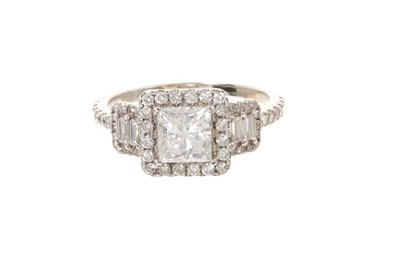 Lot 557 - Diamond ring with a central princess cut diamond weighing approximately 1.12cts, surrounded round brilliant cut diamonds flanked by baguette cut diamonds and further brilliant cut diamonds, estimat...