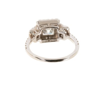 Lot 557 - Diamond ring with a central princess cut diamond weighing approximately 1.12cts, surrounded round brilliant cut diamonds flanked by baguette cut diamonds and further brilliant cut diamonds, estimat...