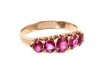 Lot 571 - Late Victorian ruby five stone ring with five oval mixed cut rubies in gold claw setting. Ring size N½.