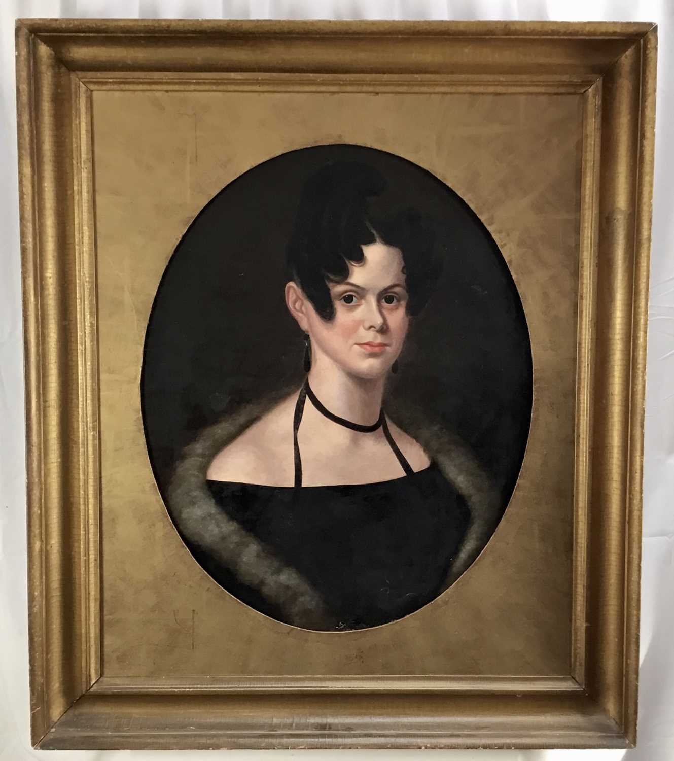 Lot 44 - Continental School, 19th century, oil on canvas - portrait of a stylish lady, 62cm x 49cm, oval, in gilt frame