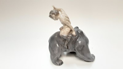 Lot 1229 - Royal Copenhagen porcelain figure of a fawn on a bears back and another of a bird (2)