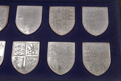 Lot 108 - Set 12 silver Royal Coats of Arms shields in fitted case and two framed silver Silver Jubilee 1977 medallions