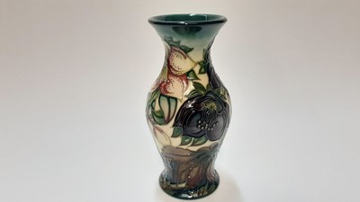 Lot 1148 - Moorcroft pottery trial vase decorated in the Hellebore pattern by Nicola Slaney, painted by Sue Barnsley, dated 4.4.00, 19cm high