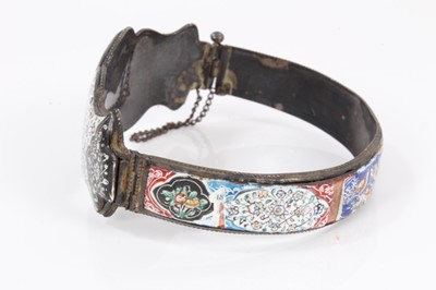 Lot 585 - Antique Persian enamel bangle and a Persian mother of pearl bracelet with polychrome painted decoration (2)