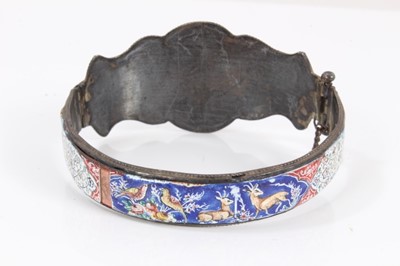 Lot 585 - Antique Persian enamel bangle and a Persian mother of pearl bracelet with polychrome painted decoration (2)