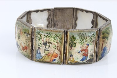 Lot 585 - Antique Persian enamel bangle and a Persian mother of pearl bracelet with polychrome painted decoration (2)