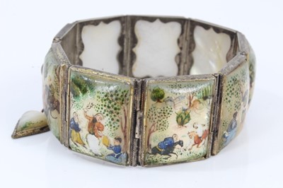 Lot 585 - Antique Persian enamel bangle and a Persian mother of pearl bracelet with polychrome painted decoration (2)